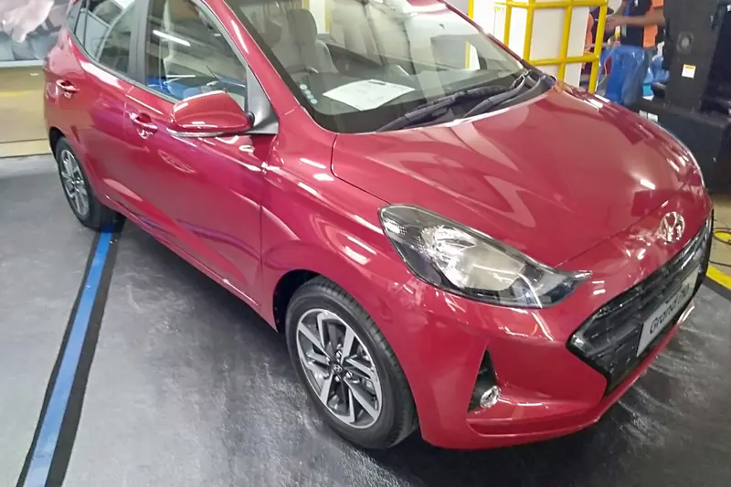 Red Hyundai Grand i10 Nios hatchback, front three-quarter view