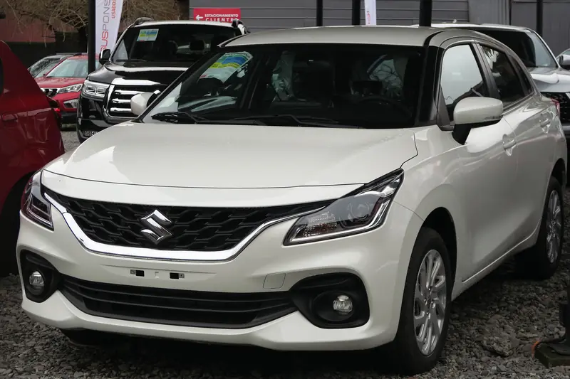 White Maruti Suzuki Baleno hatchback, front three-quarter view